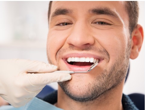 patient smiling after dental veneer placement